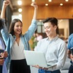 Create a professional photograph for: "La Trobe University Scholarships " AUTO-DETECT country from title → use appropriate background STUDENTS: Random number, diverse races (African, Asian, Caucasian, Hispanic), UPPER BODY/WAIST-UP only, celebrating/studying, MAIN FOCUS DIMENSIONS: EXACTLY 1200px × 630px STYLE: Bright, warm, professional, sharp focus on students/student